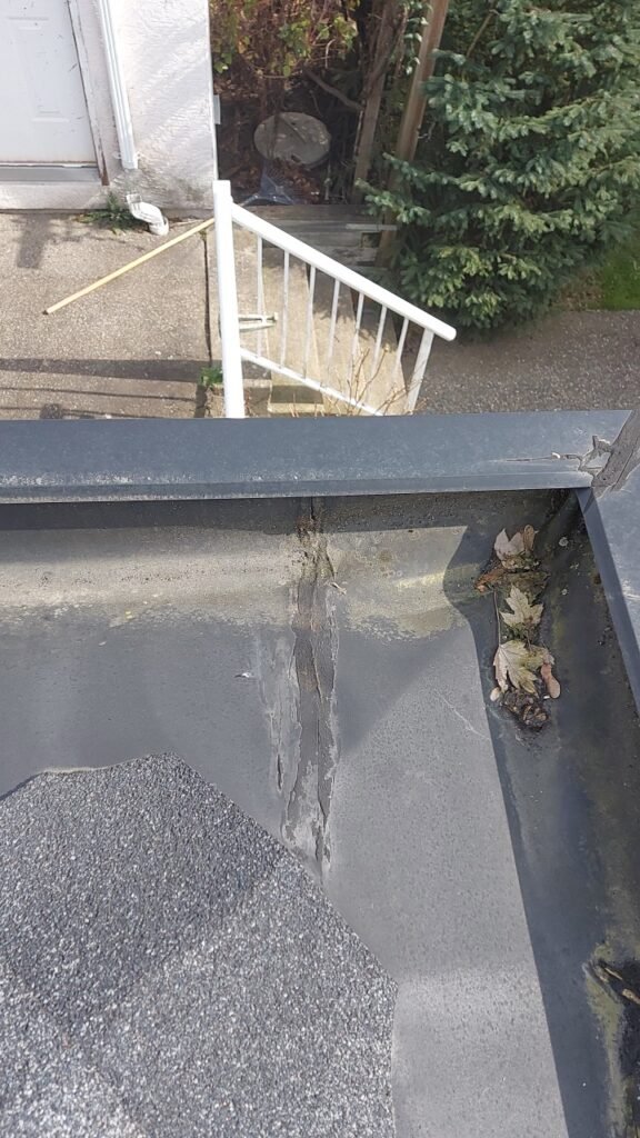 Improper caulked seam at the corner of a built-in gutter in Richmond.