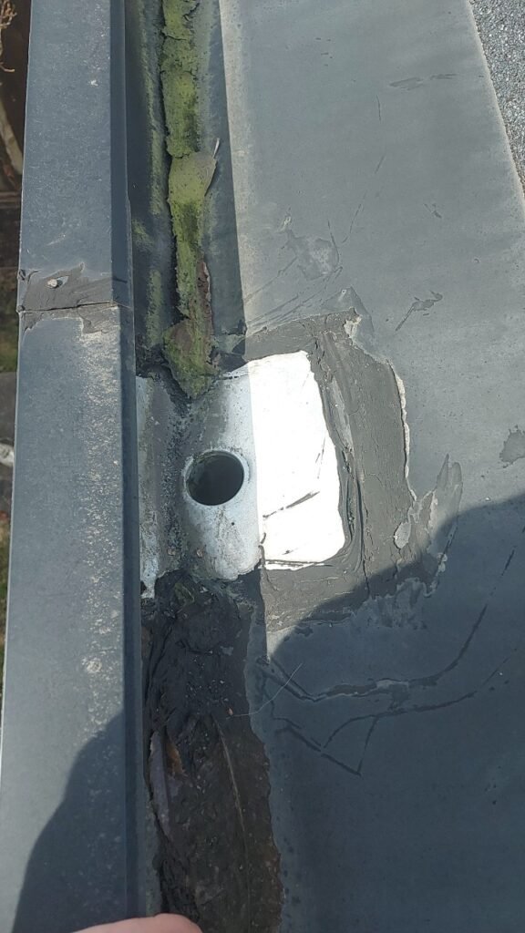 Improperly installed hidden gutter drain on a Richmond roof