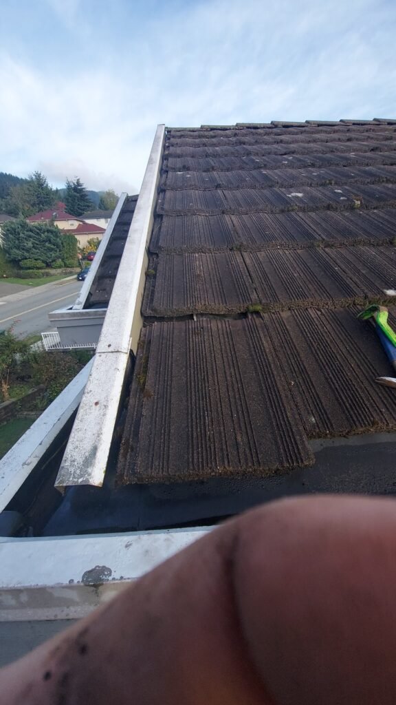 Slid concrete roof tile leaving a gap that let water under the tiles on a Coquitlam roof.