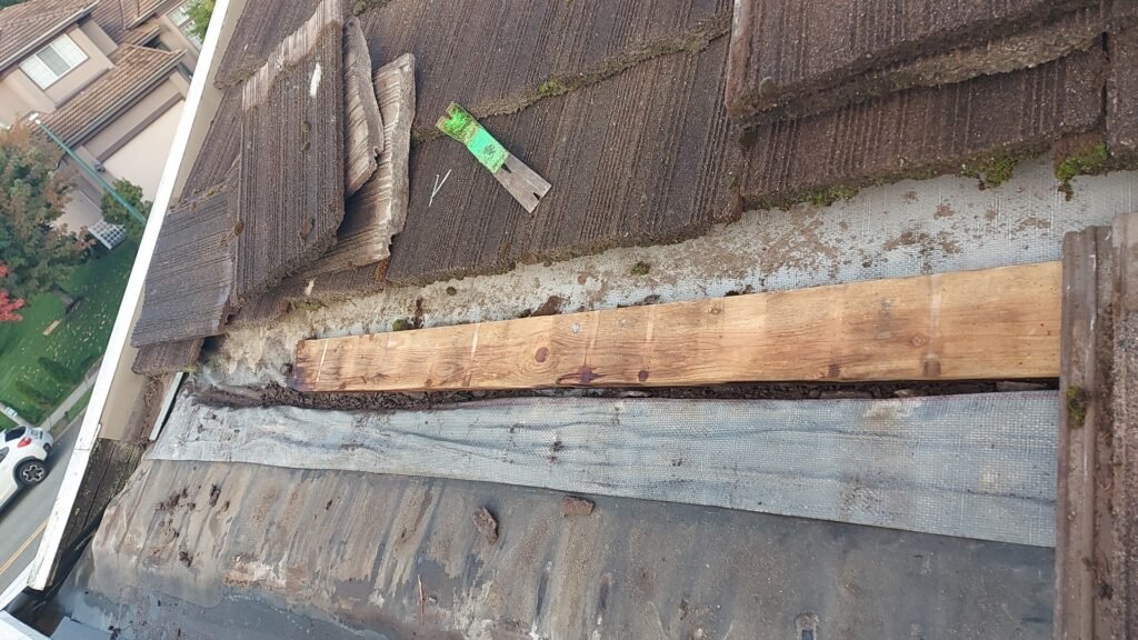 Channel along the eave underlay of a tile roof that carried water away from the slid tile in Coquitlam.