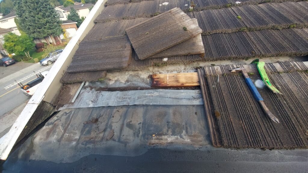 Underlay channel along the eave of a tile roof in Coquitlam where water collected instead of draining.