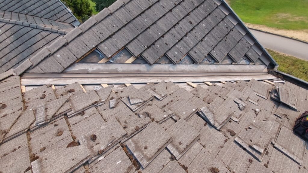 Cleaned metal valley flashing on a concrete tile roof in Abbotsford before the tiles go back on.