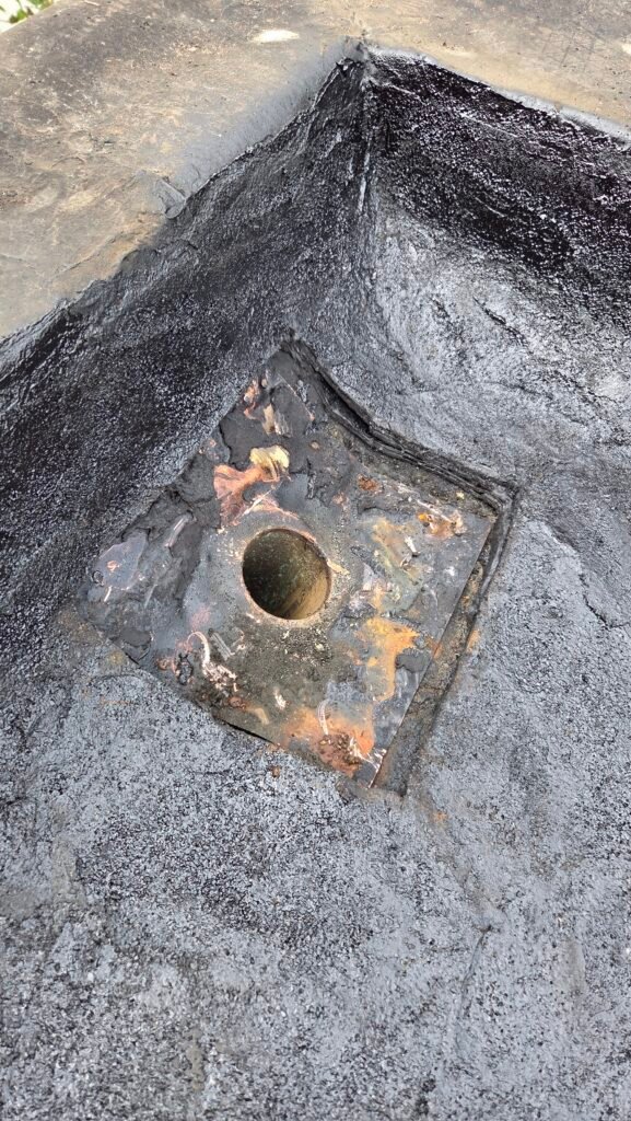 Old drain membrane cut out, about to remove the old drain on a torch-on roof in New Westminster.