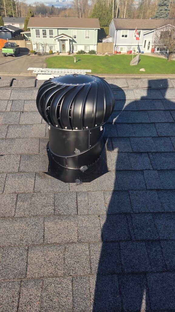 A finished Lomanco Whirlybird turbine vent installed and leveled on an asphalt shingle roof in Aldergrove.