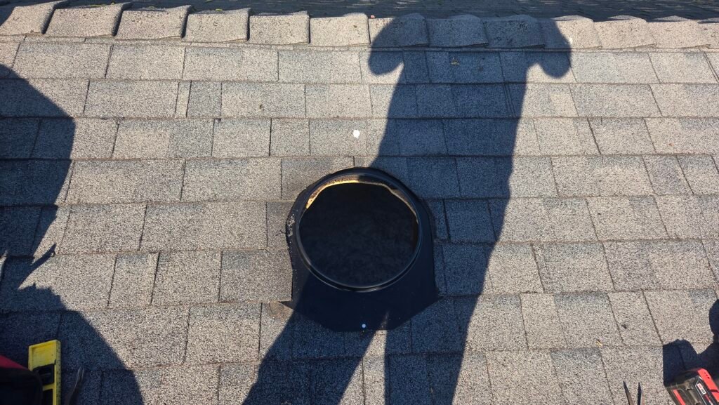 Turbine Vent Installation in Aldergrove 2 Asphalt shingles reinstalled over a turbine vent base on a roof in Aldergrove.